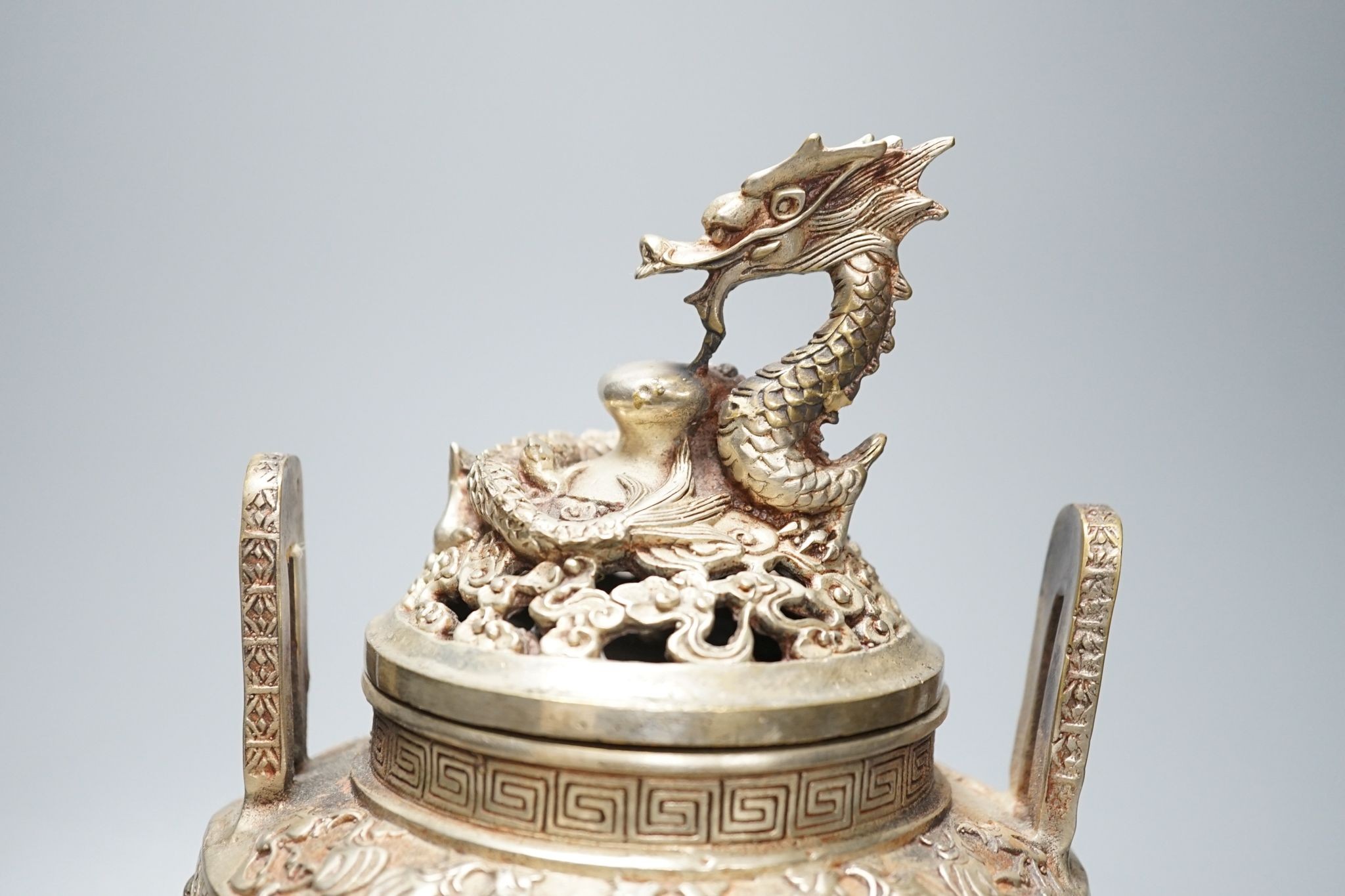 A Chinese bronze 'dragon' censer and cover, 24.5 cms high